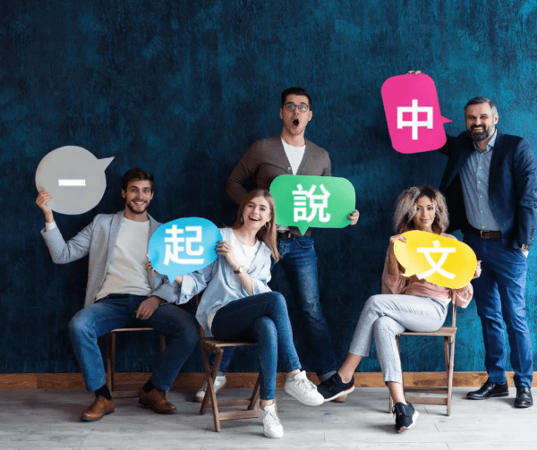 A group of people holding up speech bubbles.