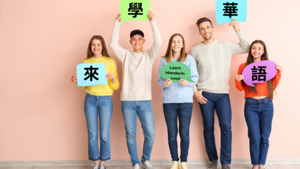 A group of people holding signs with different languages.